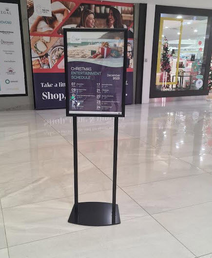 Double Sided black sign holder Snap Frame Display Black A2 Poster Stand 2 x 25mm Profile Snap Frames Powdercoated Black Takes Poster Size A2 Portrait format 420mm wide x 594mm high with Visible area 411mm w x 585mm h Assembled height 1520mm to top of frame Snap Frames Supplied with Clear Poster Cover Sheets