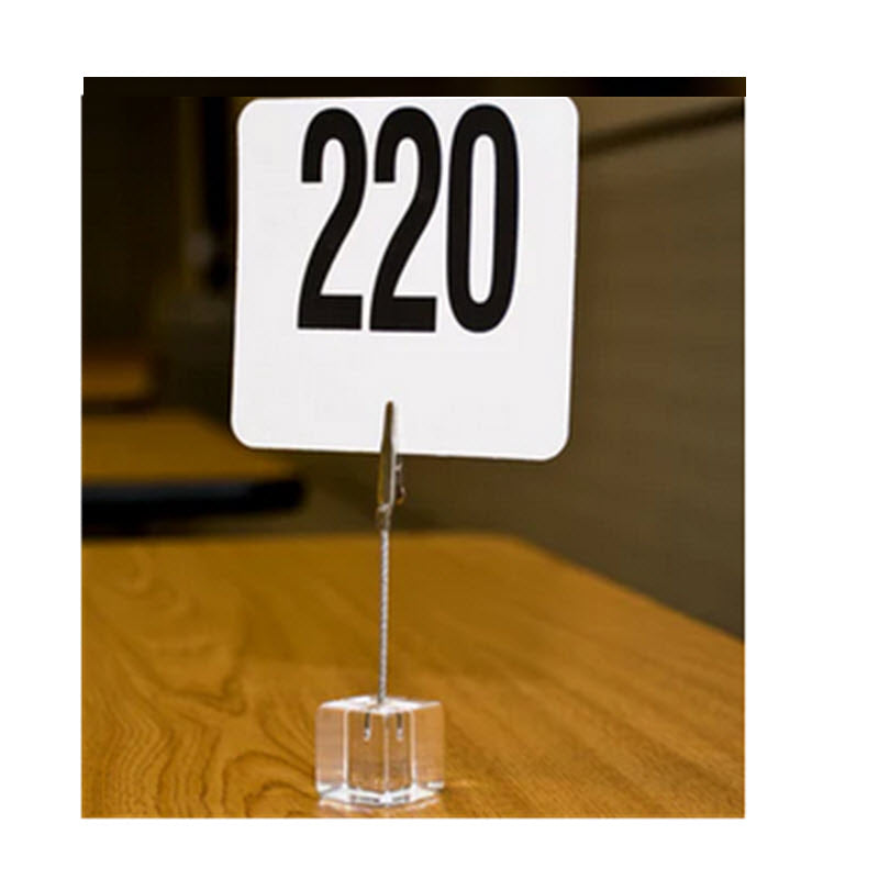 This simple and convenient 4" high  card holder on a Crystal Clear Acrylic Base allows you to showcase your specials out in the Counter Cabinet or hold table number cards  This piece features a Alligator clip top to attractively display information right on your tabletop, or counter display cabinet..  The weighted base stabilizes the holde
