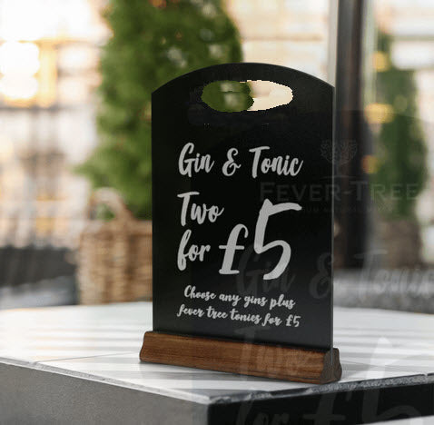 Table or counter top display size Black chalkboard arched top with handle cut out. Wooden Varnished Pine base, 54mm deep. O/A Height to top of unit 325mm x 210mm wide. Ideal size for displaying specials, offers, as an effective way of marketing to your customers at their table or at the counter top.