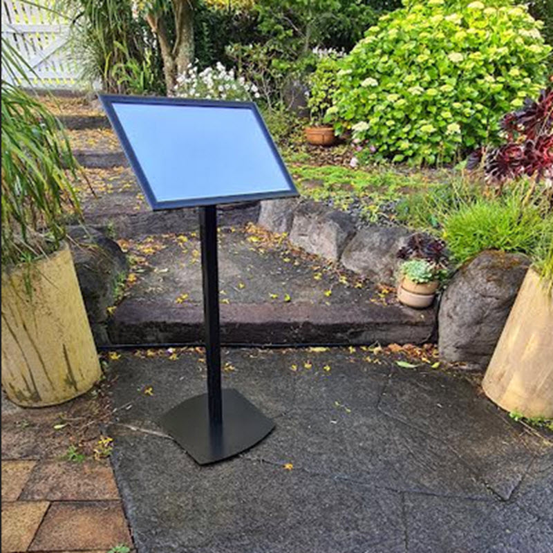 A3 Restaurant Menu Stand / Commercial Poster Display stand. Designed by us to meet Client Requests, Components NZ Manufactured. Features A3 Landscape or Portrait format Waterproof Wide Profile Black Snap Frame with sprung opening 4 Sides for Easy Media Changes 1mm clear Protective Poster Cover sheet to Protect Display , Easy to Clean Fixed 45 degree viewing angle. Rear Plate fixing allows landscape or Portrait display Landscape or Portrait Display