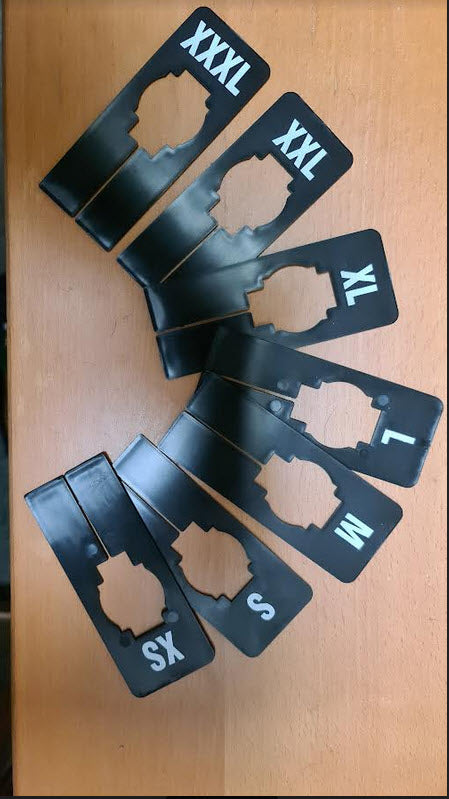 Pack of 7 Black Rectangular Rack Dividers White lettering printed to both sides Durable Plastic Sizes XS,S,M ,L,XL,XXL,XXXL Supplied pack contains 1 of each size. 50mm x 125mm with 40mm Centre new shape ensures display stays u