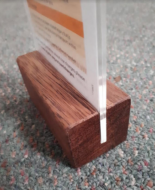 Widely Used Within Hospitality Industry As Table Talkers, Menu and other Display/ Information Holders DLE Acrylic Sleeve Display Panel on Hardwood Base Provides Full Double Sized Viewing of DLE above the Base Sleeve Design Opens to Allow Displays to be Easily Inserted Suitable for DLE Size Portrait sheets each 103mm w x 210mm high Durable Design High Impact Clear Acrylic. Acrylic Secured into Base. Allows Displays to be Protected from Dust and Spills, Easily Cleaned