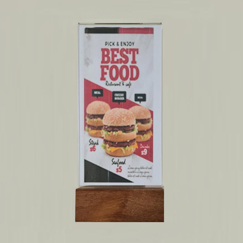 Widely Used Within Hospitality Industry As Table Talkers, Menu and other Display/ Information Holders DLE Acrylic Sleeve Display Panel on Hardwood Base Provides Full Double Sized Viewing of DLE above the Base Sleeve Design Opens to Allow Displays to be Easily Inserted Suitable for DLE Size Portrait sheets each 103mm w x 210mm high Durable Design High Impact Clear Acrylic. Acrylic Secured into Base. Allows Displays to be Protected from Dust and Spills, Easily Cleaned