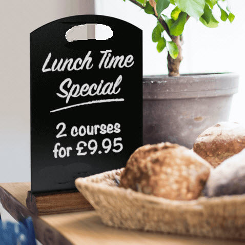 Table or counter top display size Black chalkboard arched top with handle cut out. Wooden Varnished Pine base, 54mm deep. O/A Height to top of unit 310mm x 210mm wide. Ideal size for displaying specials, offers, as an effective way of marketing to your customers at their table or at the counter top.