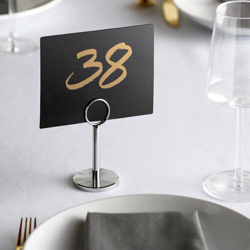 This simple and convenient 4" stainless steel menu / card holder is the best way to showcase your specials out in the open. This piece features a ring top to attractively display information right on your tabletop.