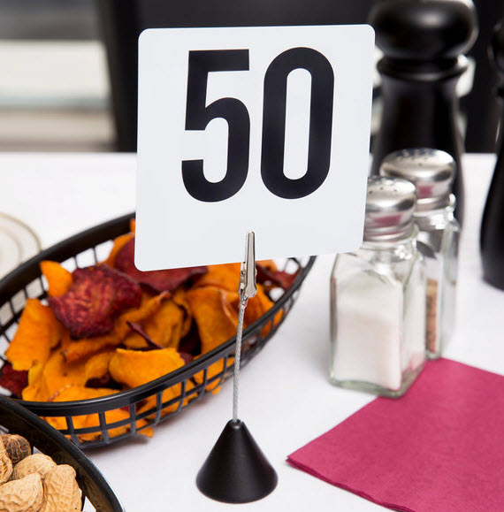 1 to 50 Table Number set Keep your tables easily identifiable with this set of white plastic number cards! This set includes cards for tables 1 through 50, with bold black numbering on both sides of each card.
